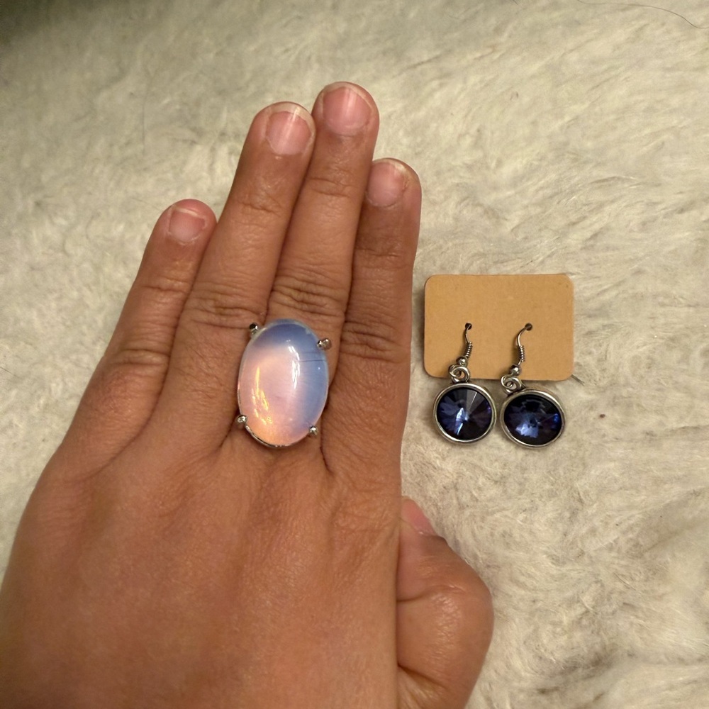Oval Statement Ring with Iridescent Blue-Pink Glow and dark blue stone earrings